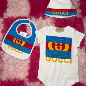 Gucci Kids' White Bib, Onesie And Beanie Set with Blue, Red, and Yellow Accents